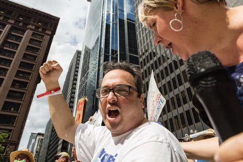 Man holding fist up in protest